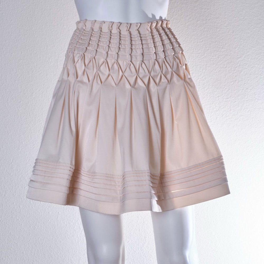 MaxMara: Pleaded Cream Mini Skirt